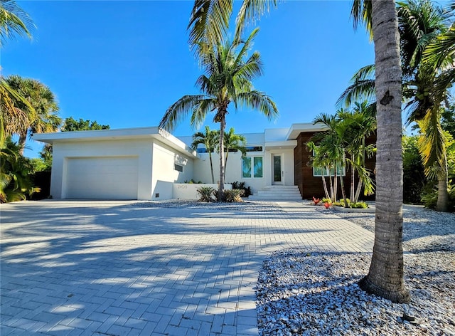 2408 Nassau St, Sarasota, FL 34231 - view of front of house featuring decorative driveway, a garage, and stucco siding