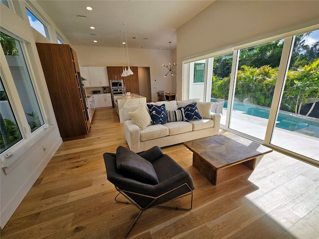 2408 Nassau St, Sarasota, FL 34231 - living area featuring a chandelier, light wood-style floors, and recessed lighting
