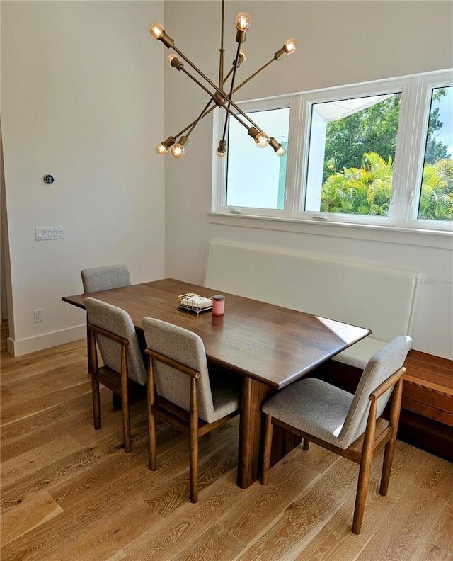 2408 Nassau St, Sarasota, FL 34231 - dining area with light wood finished floors and a chandelier