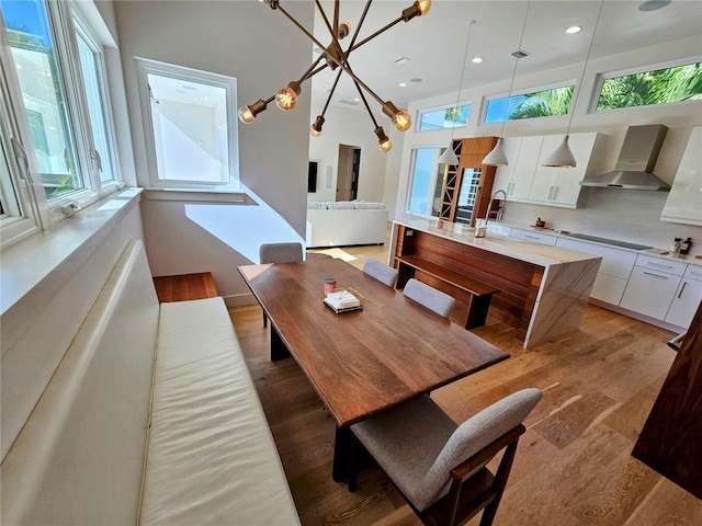 2408 Nassau St, Sarasota, FL 34231 - dining area with light wood-type flooring, recessed lighting, and a chandelier