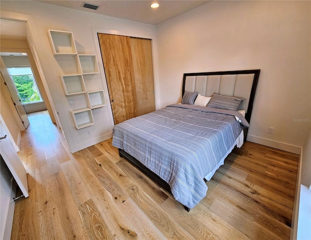 2408 Nassau St, Sarasota, FL 34231 - bedroom with light wood-style flooring, baseboards, a closet, and recessed lighting