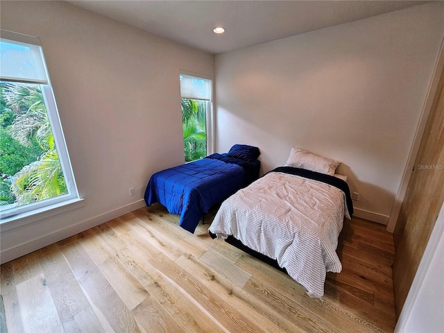2408 Nassau St, Sarasota, FL 34231 - bedroom with multiple windows, baseboards, wood finished floors, and recessed lighting