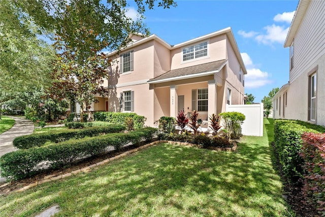 3426 Schoolhouse Rd, Harmony, FL 34773 - traditional-style house with stucco siding and a front yard