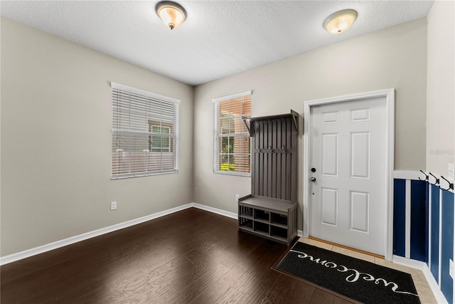 3426 Schoolhouse Rd, Harmony, FL 34773 - entrance foyer featuring wood finished floors and a textured ceiling