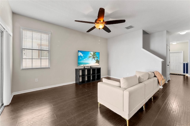 3426 Schoolhouse Rd, Harmony, FL 34773 - living room with a ceiling fan and dark wood finished floors