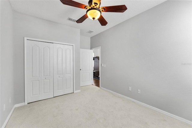 3426 Schoolhouse Rd, Harmony, FL 34773 - unfurnished bedroom with carpet floors, a closet, and ceiling fan
