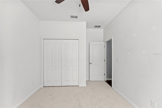 3426 Schoolhouse Rd, Harmony, FL 34773 - unfurnished bedroom featuring a closet, carpet, and a ceiling fan