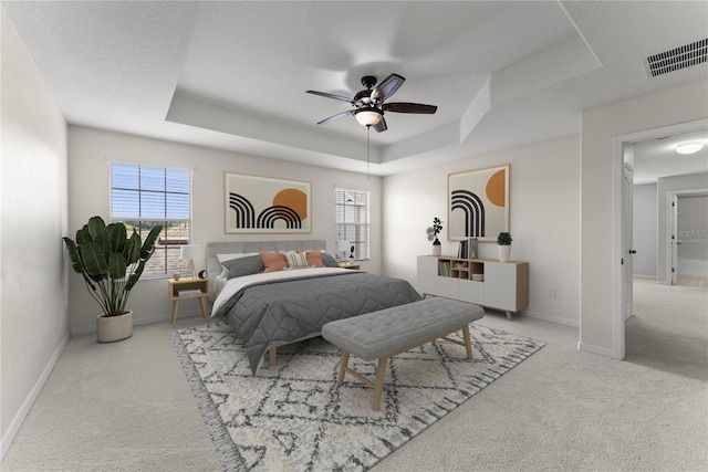 3426 Schoolhouse Rd, Harmony, FL 34773 - bedroom featuring carpet, a tray ceiling, and ceiling fan