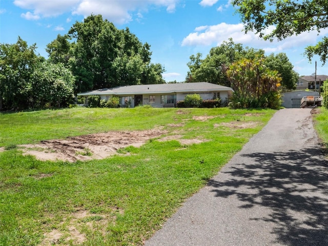 12130 Lakeshore Dr, Clermont, FL 34711 - ranch-style house with a front lawn