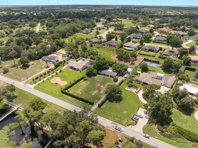12130 Lakeshore Dr, Clermont, FL 34711 - aerial overview of property's location with nearby suburban area