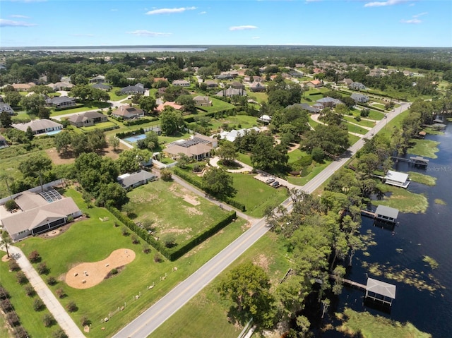 12130 Lakeshore Dr, Clermont, FL 34711 - aerial view of property and surrounding area with a large body of water and nearby suburban area