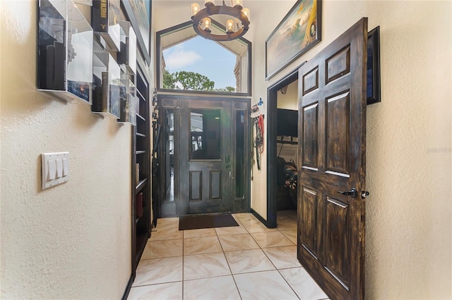 9774 Bohart Ct, Orlando, FL 32836 - entryway with a textured wall, a chandelier, and a towering ceiling