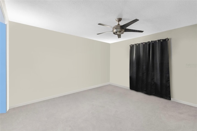 9774 Bohart Ct, Orlando, FL 32836 - empty room with light colored carpet, ceiling fan, and a textured ceiling