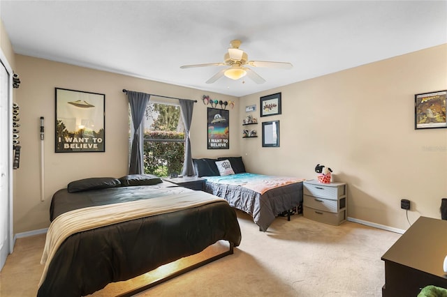 9774 Bohart Ct, Orlando, FL 32836 - bedroom with light carpet and a ceiling fan