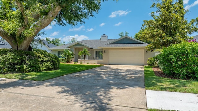 8473 Granada Blvd, Orlando, FL 32836 - ranch-style house featuring a garage, concrete driveway, a chimney, stucco siding, and a front yard