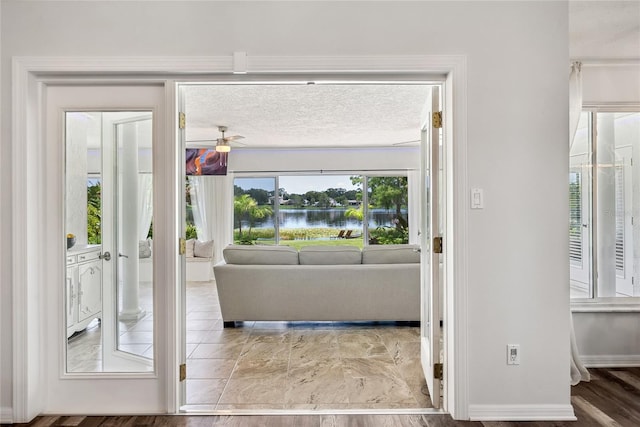 8473 Granada Blvd, Orlando, FL 32836 - doorway to outside featuring ceiling fan and baseboards