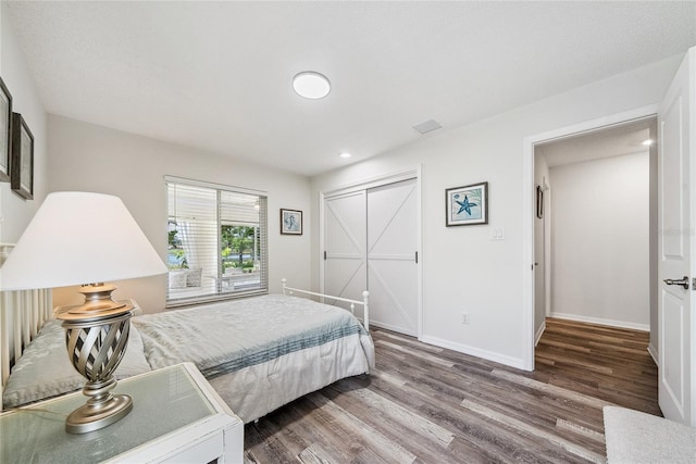8473 Granada Blvd, Orlando, FL 32836 - bedroom with wood finished floors, baseboards, and recessed lighting