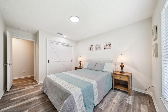 8473 Granada Blvd, Orlando, FL 32836 - bedroom featuring wood finished floors, baseboards, and a closet