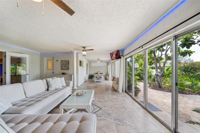 8473 Granada Blvd, Orlando, FL 32836 - living area featuring a ceiling fan, plenty of natural light, and a textured ceiling