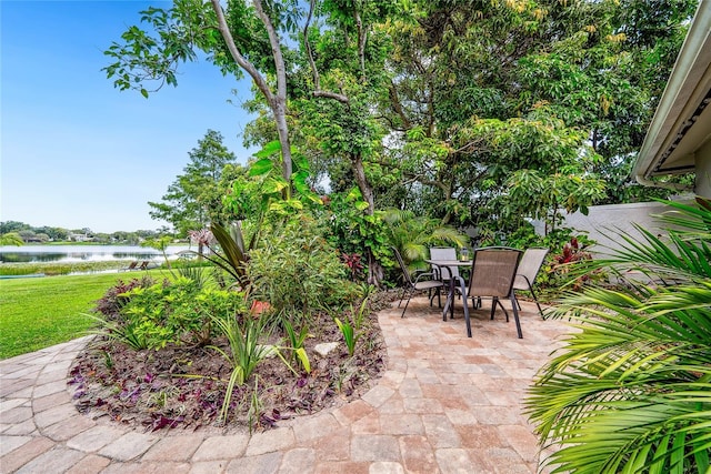 8473 Granada Blvd, Orlando, FL 32836 - view of patio with a water view and outdoor dining area