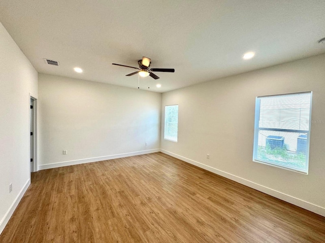 319 Anchovie Ct, Poinciana, FL 34759 - empty room featuring wood finished floors, ceiling fan, recessed lighting, and baseboards
