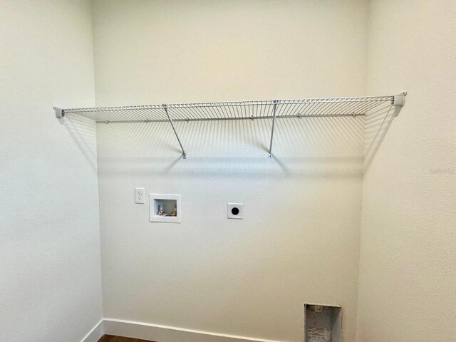 319 Anchovie Ct, Poinciana, FL 34759 - washroom with electric dryer hookup, washer hookup, and baseboards