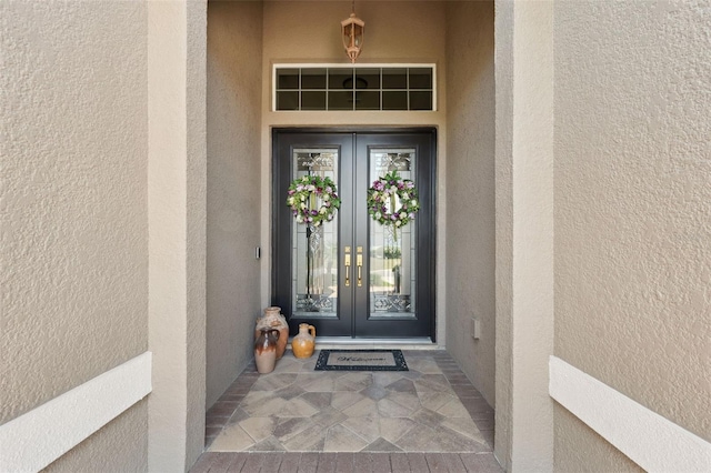 9426 Burnam Dr, Weeki Wachee, FL 34613 - property entrance with french doors and stucco siding