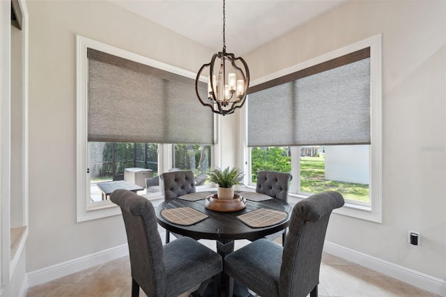 9426 Burnam Dr, Weeki Wachee, FL 34613 - dining room with plenty of natural light, a chandelier, baseboards, and light tile patterned flooring