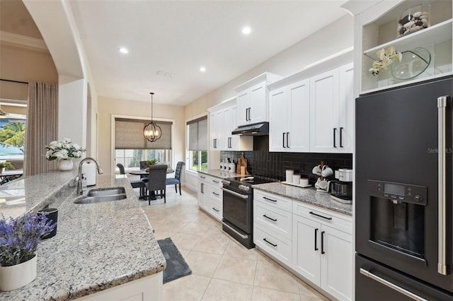 9426 Burnam Dr, Weeki Wachee, FL 34613 - kitchen featuring refrigerator with ice dispenser, black range with electric stovetop, a sink, tasteful backsplash, and white cabinets