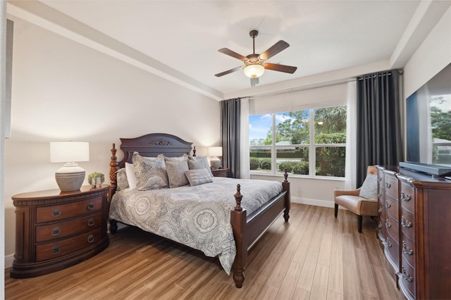 9426 Burnam Dr, Weeki Wachee, FL 34613 - bedroom featuring wood finished floors, baseboards, and a ceiling fan