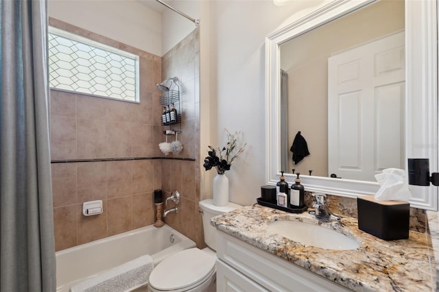 9426 Burnam Dr, Weeki Wachee, FL 34613 - full bathroom featuring toilet, vanity, and shower / bath combination
