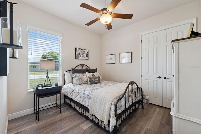 9426 Burnam Dr, Weeki Wachee, FL 34613 - bedroom with wood finished floors, a closet, a ceiling fan, and baseboards