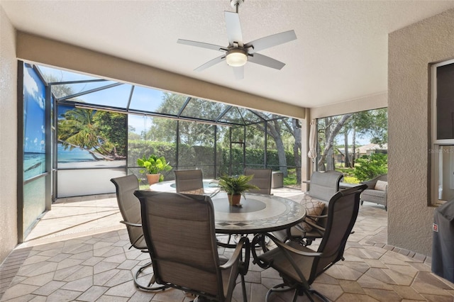 9426 Burnam Dr, Weeki Wachee, FL 34613 - sunroom with ceiling fan, healthy amount of natural light, and outdoor dining space