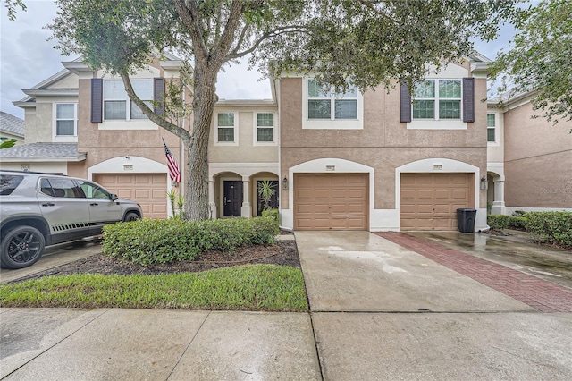 26622 Castleview Way, Wesley Chapel, FL 33544 - view of property featuring driveway, a garage, and stucco siding
