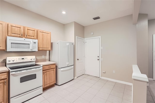 26622 Castleview Way, Wesley Chapel, FL 33544 - kitchen with white appliances, light countertops, light tile patterned floors, recessed lighting, and baseboards