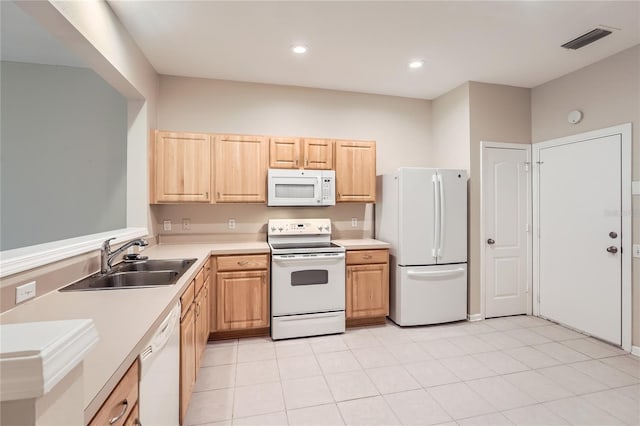 26622 Castleview Way, Wesley Chapel, FL 33544 - kitchen with white appliances, a sink, light brown cabinetry, light countertops, and recessed lighting