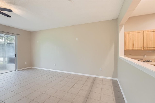 26622 Castleview Way, Wesley Chapel, FL 33544 - unfurnished room featuring a ceiling fan, baseboards, and light tile patterned floors