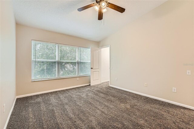 26622 Castleview Way, Wesley Chapel, FL 33544 - empty room featuring ceiling fan, vaulted ceiling, carpet floors, and baseboards