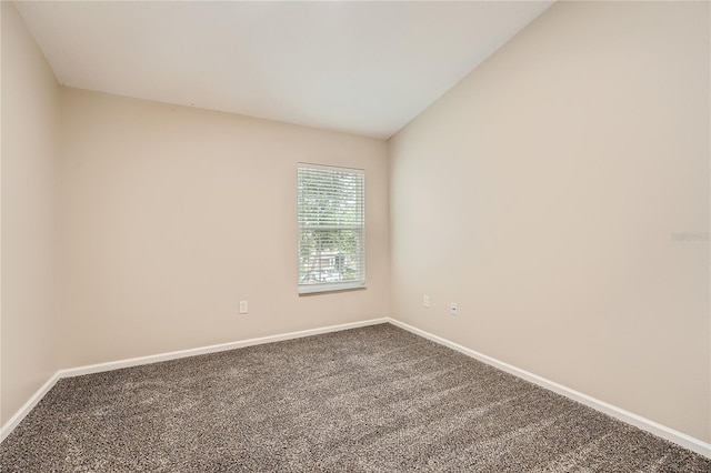26622 Castleview Way, Wesley Chapel, FL 33544 - empty room featuring baseboards, carpet floors, and lofted ceiling