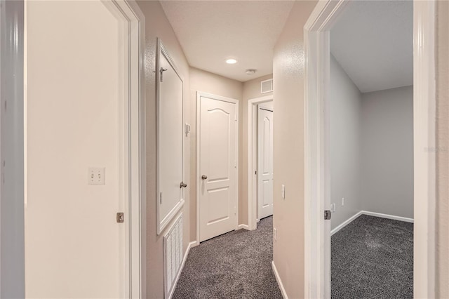 26622 Castleview Way, Wesley Chapel, FL 33544 - hallway featuring dark carpet, baseboards, and recessed lighting