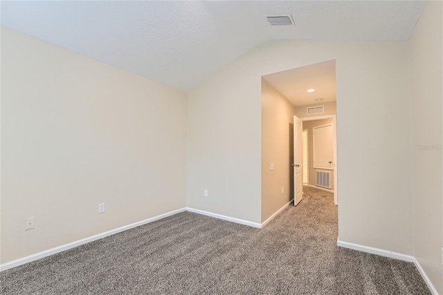 26622 Castleview Way, Wesley Chapel, FL 33544 - empty room with carpet floors, vaulted ceiling, and baseboards