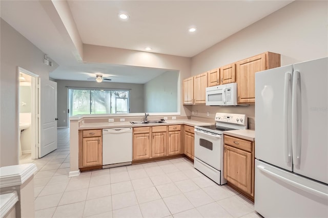 26622 Castleview Way, Wesley Chapel, FL 33544 - kitchen with white appliances, a sink, light countertops, a peninsula, and light brown cabinets