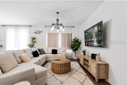 2363 Lancashire St, Davenport, FL 33896 - living area with a chandelier and wood finished floors