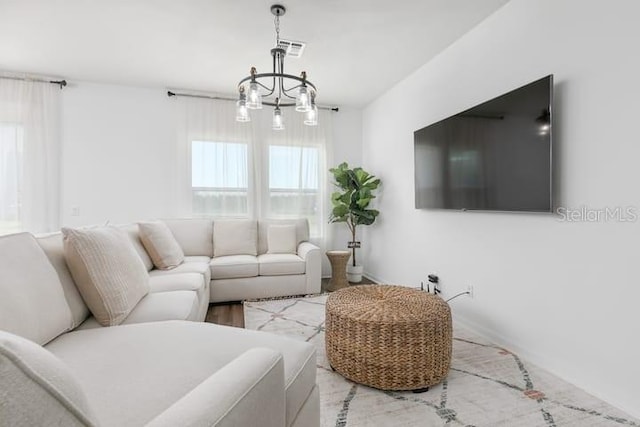2363 Lancashire St, Davenport, FL 33896 - living room with a chandelier