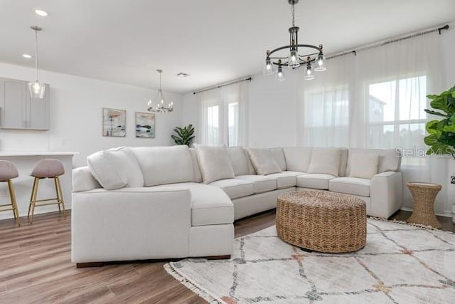 2363 Lancashire St, Davenport, FL 33896 - living area featuring a chandelier, wood finished floors, and recessed lighting