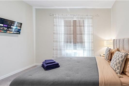 2363 Lancashire St, Davenport, FL 33896 - carpeted bedroom with baseboards
