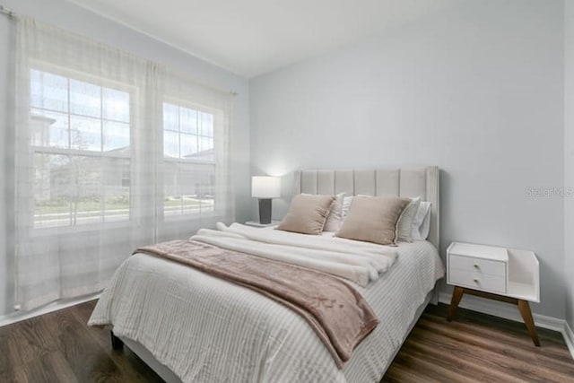 2363 Lancashire St, Davenport, FL 33896 - bedroom featuring dark wood-style flooring and baseboards