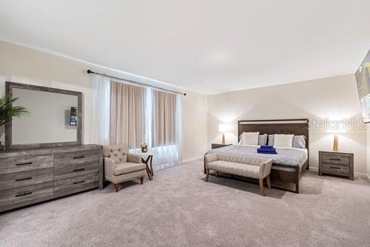 2363 Lancashire St, Davenport, FL 33896 - carpeted bedroom featuring baseboards