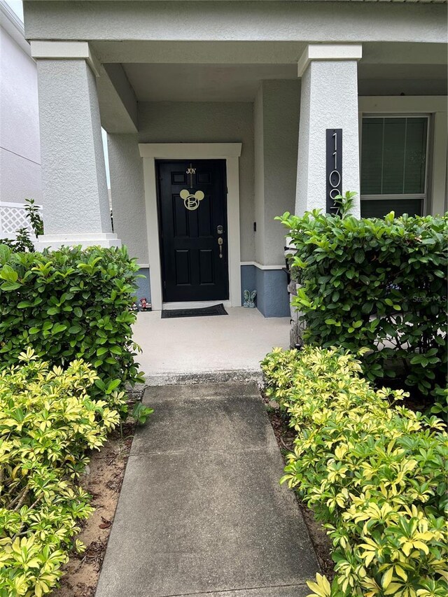 11097 N Folklore St, Winter Garden, FL 34787 - property entrance featuring stucco siding