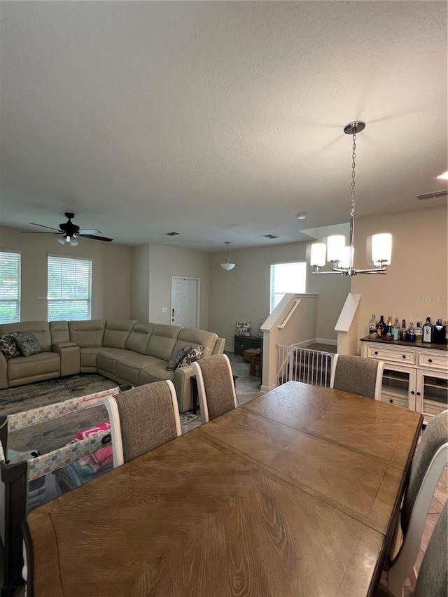 11097 N Folklore St, Winter Garden, FL 34787 - dining room featuring a chandelier and ceiling fan